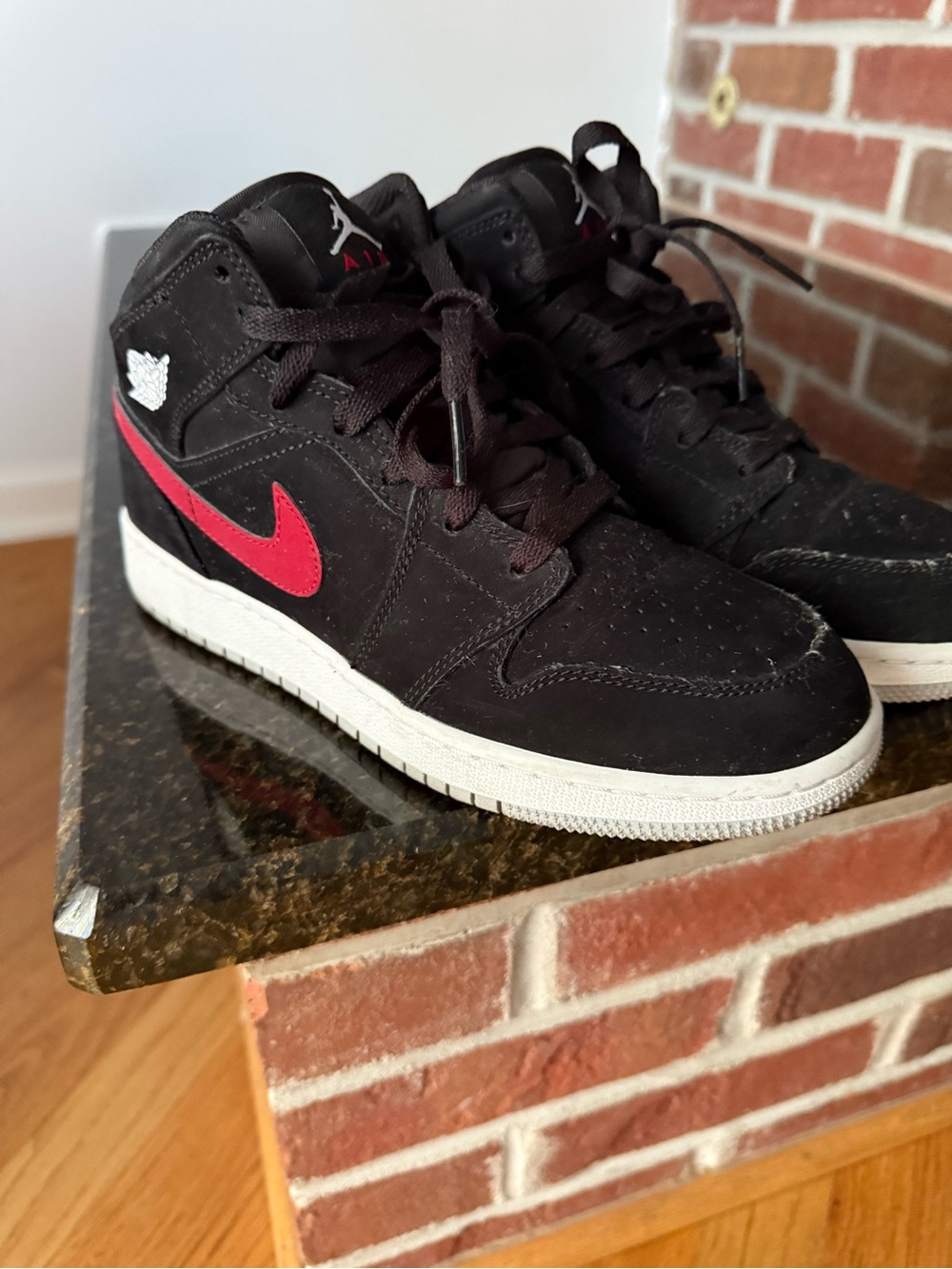 Nike Kids Black High-Top Sneakers with Red Swoosh